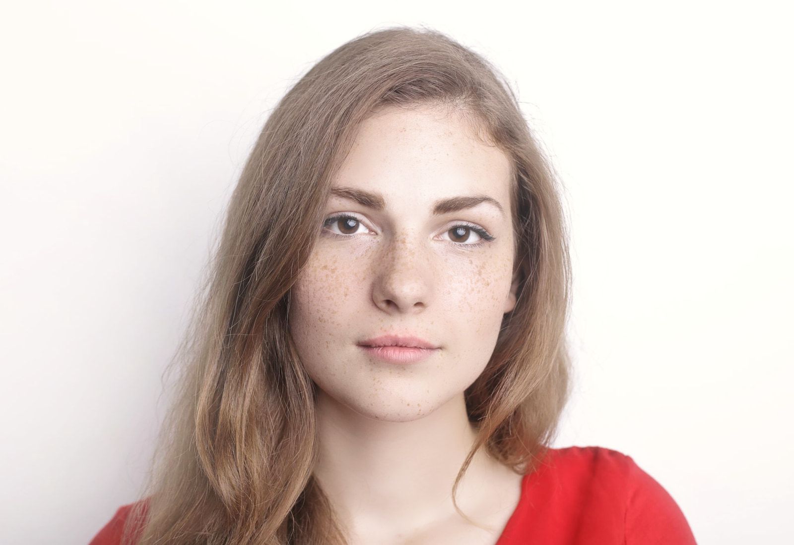 The same portrait with the glow preset: brighter skin with a soft glow